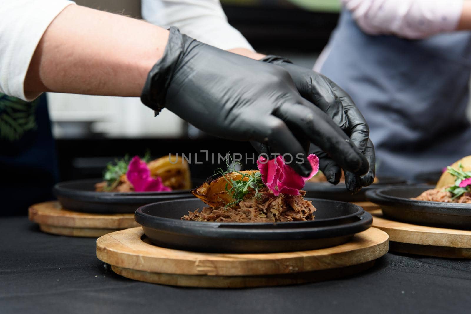 Plate of tasty Swiss dish with venison and cabbage served with herbs.