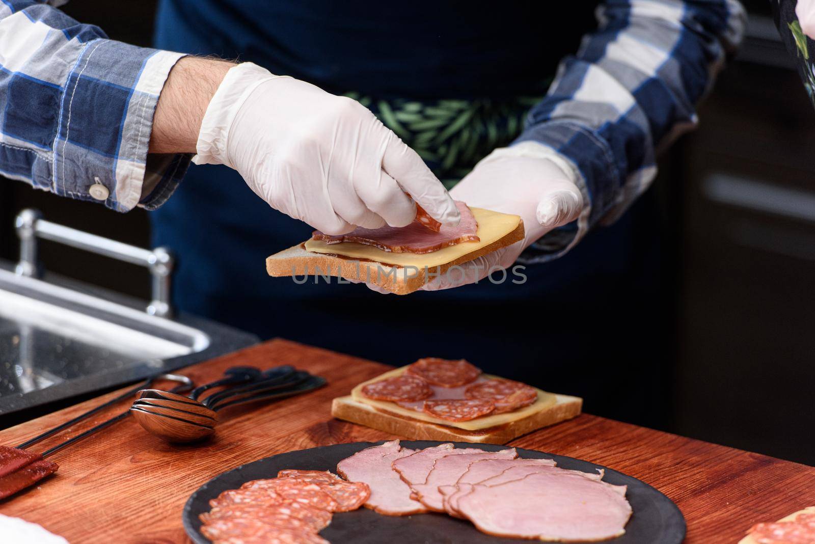 Francesinha, traditional Portuguese sandwich originally from Porto. National cuisine concept. the chef prepares a dish at restaurant by Ashtray25