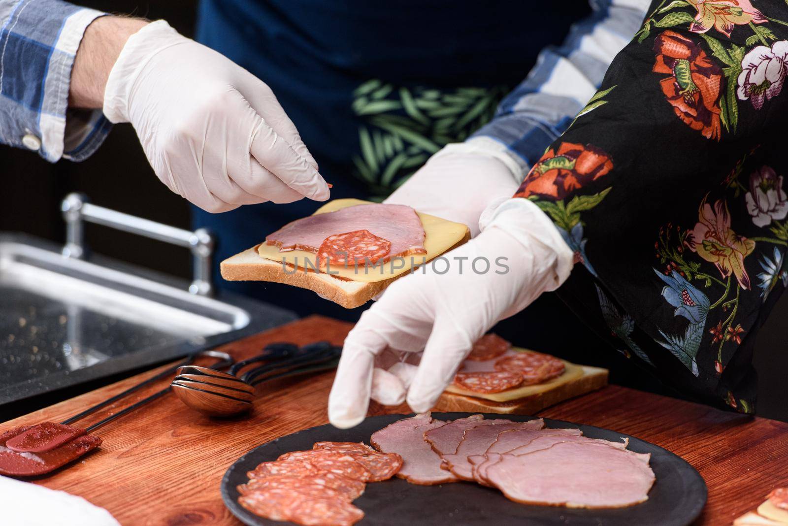 Francesinha, traditional Portuguese sandwich originally from Porto. National cuisine concept. the chef prepares a dish at restaurant.