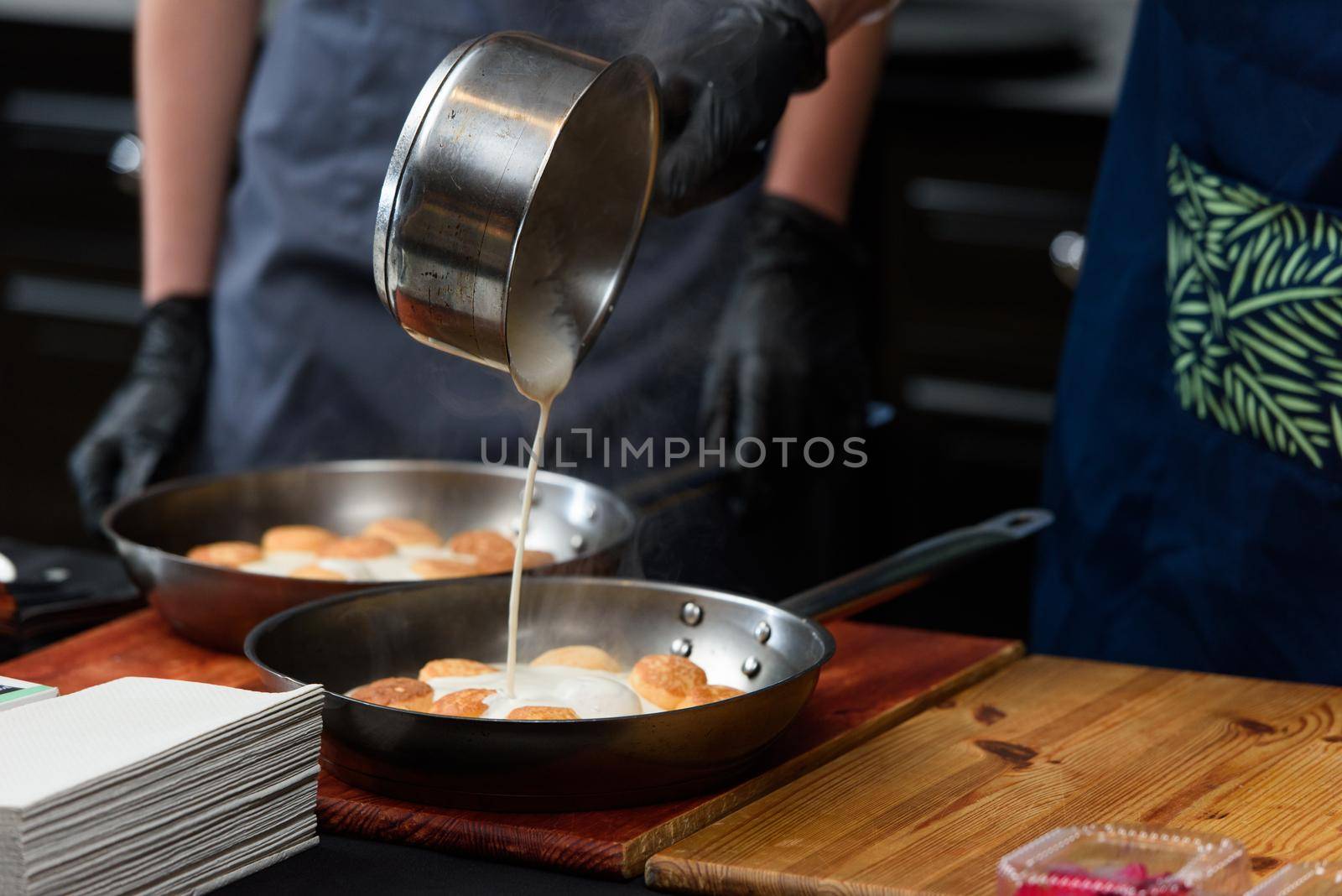 the chef prepares a dish of fish balls in a creamy sauce by Ashtray25