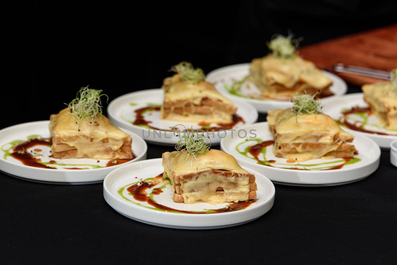 Francesinha, traditional Portuguese sandwich originally from Porto. National cuisine concept. the chef prepares a dish at restaurant by Ashtray25