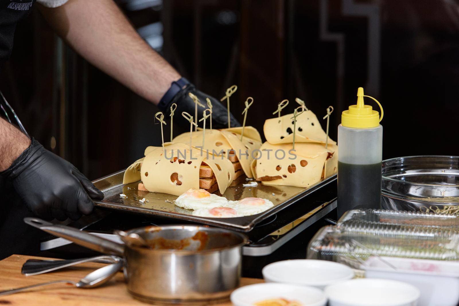 Francesinha, traditional Portuguese sandwich originally from Porto. National cuisine concept. the chef prepares a dish at restaurant.