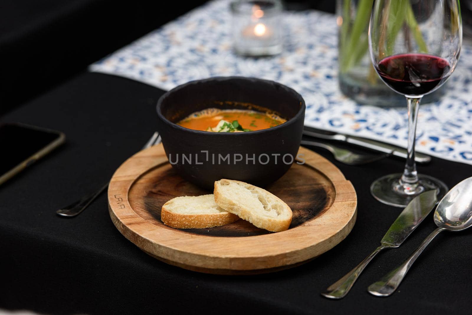 Seafood spicy soup with potatoes, shrimps, herbs and fish from a picad closeup in a pan served with toast. horizontal by Ashtray25