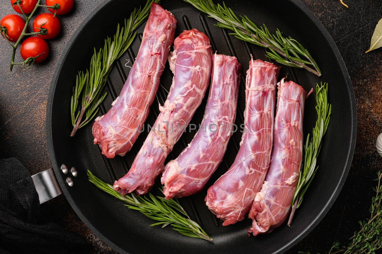 Bird chicken giblets gizzards stomachs set, on old dark rustic table background, top view flat lay