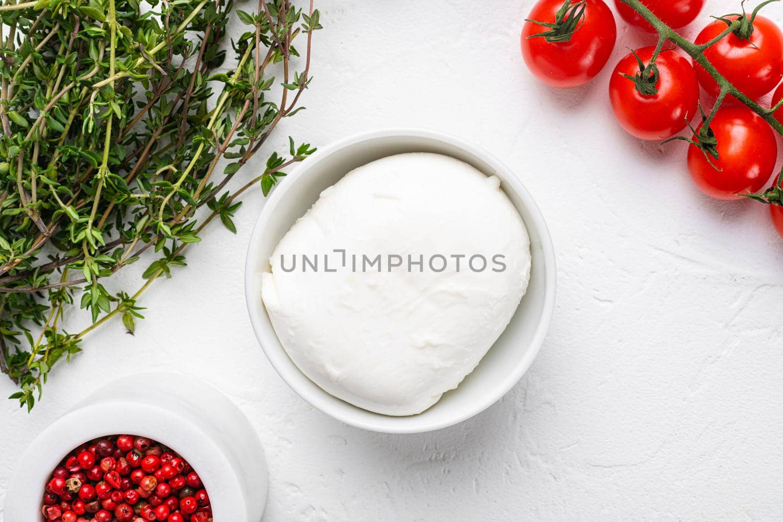 Traditional mozzarella cheese, on white stone table background, top view flat lay by Ilianesolenyi