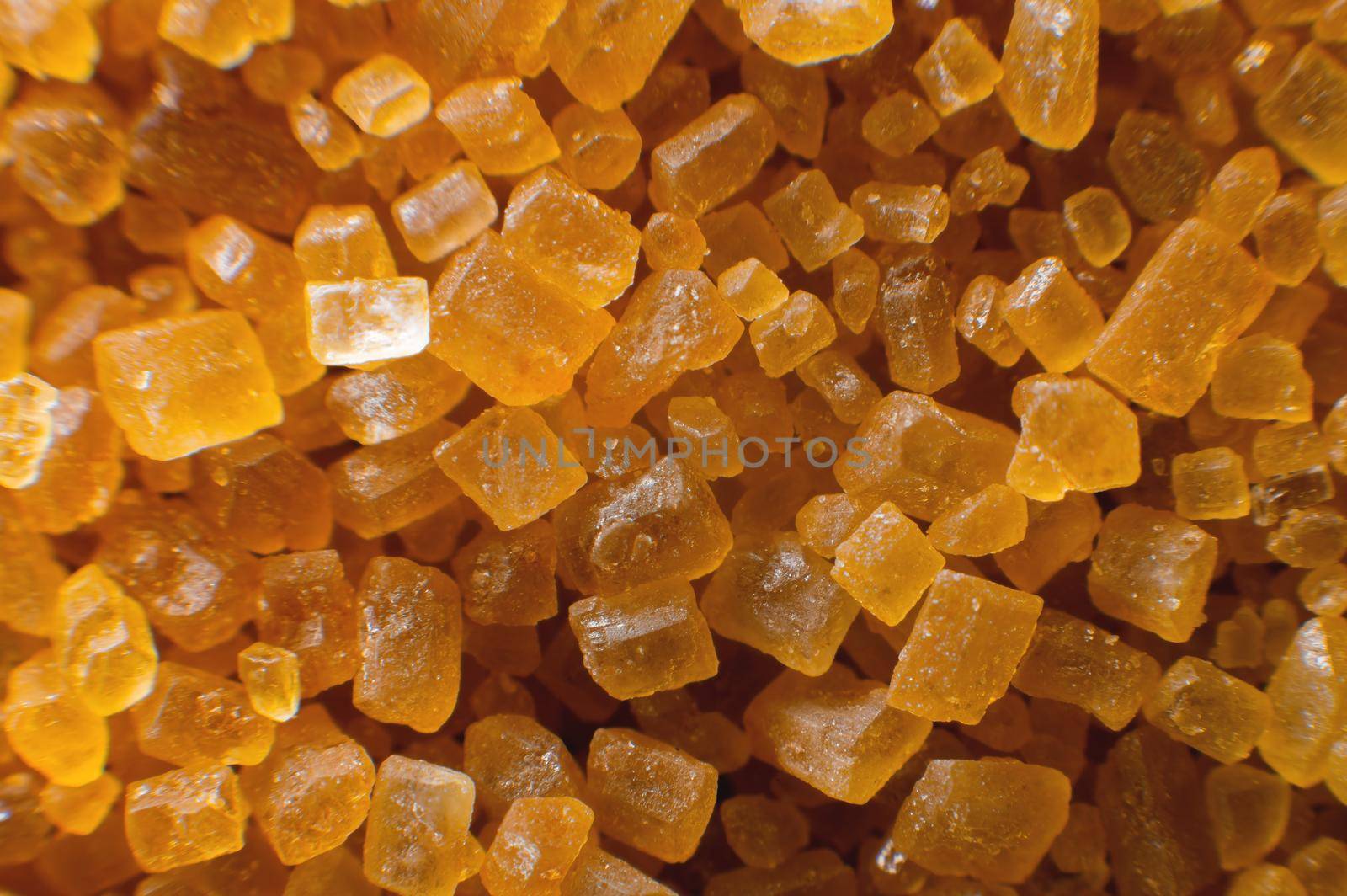 Extreme macro crystals of cane sugar. Abstract sugar background close-up in shallow depth of focus.