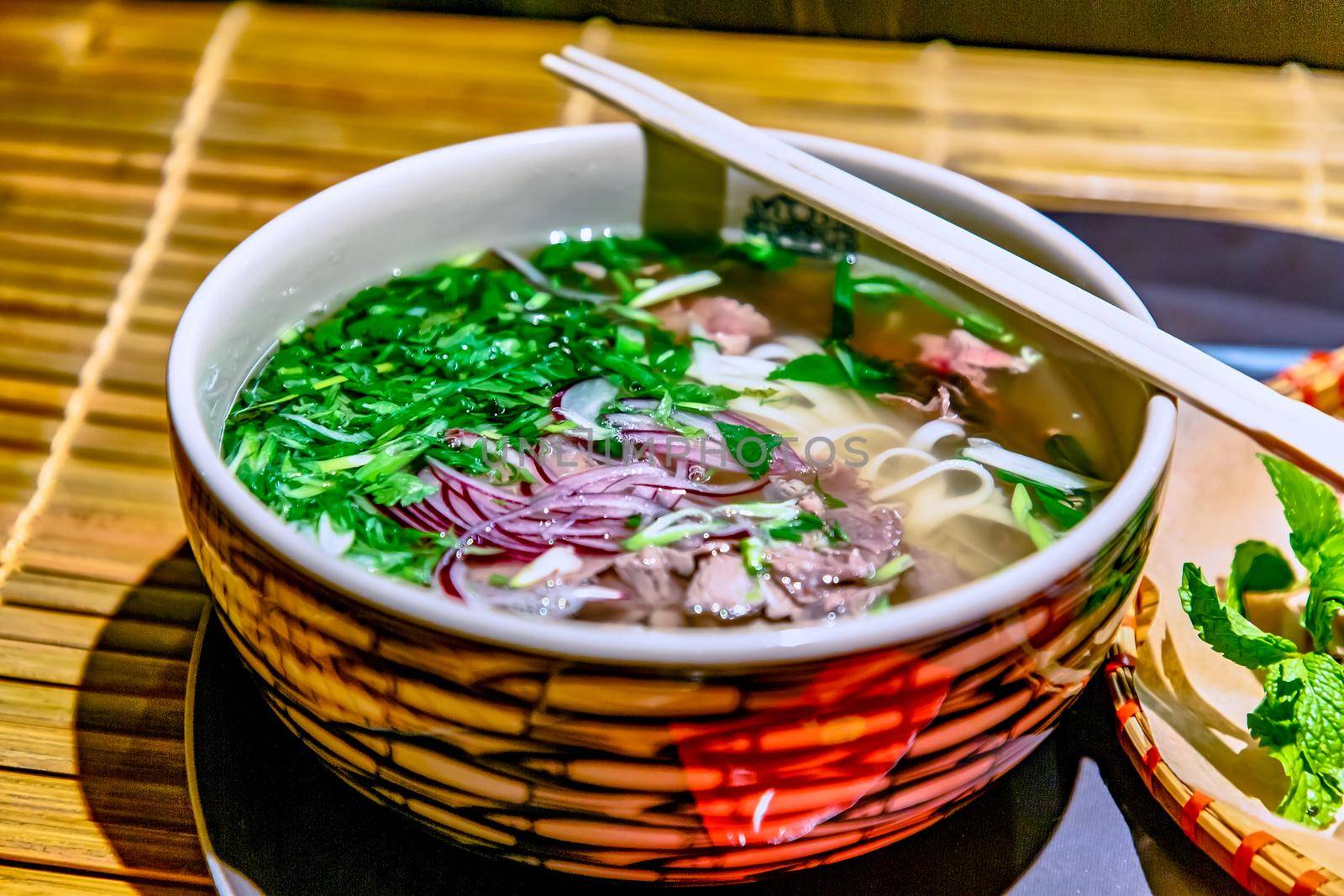 Traditional Vietnamese soup, Pho Bo in a large bowl.
