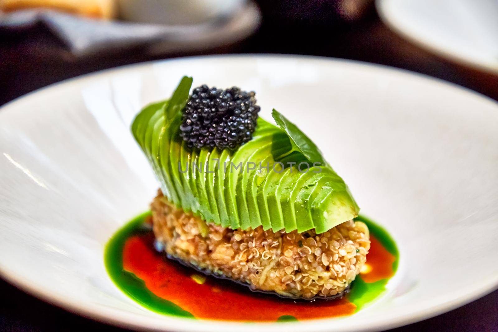 Fish or crab cutlet with avocado and halibut caviar.