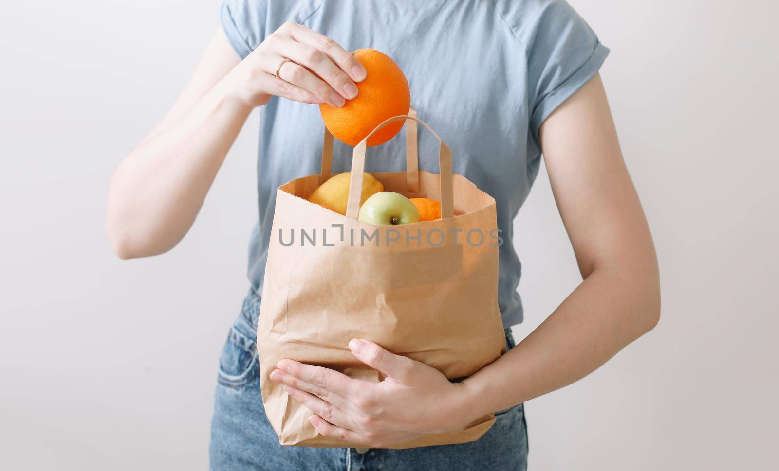 Delivery healthy food background. Vegan vegetarian food in paper bag vegetables and fruits on white, copy space, banner.Grocery shopping food supermarket and clean vegan eating concept.