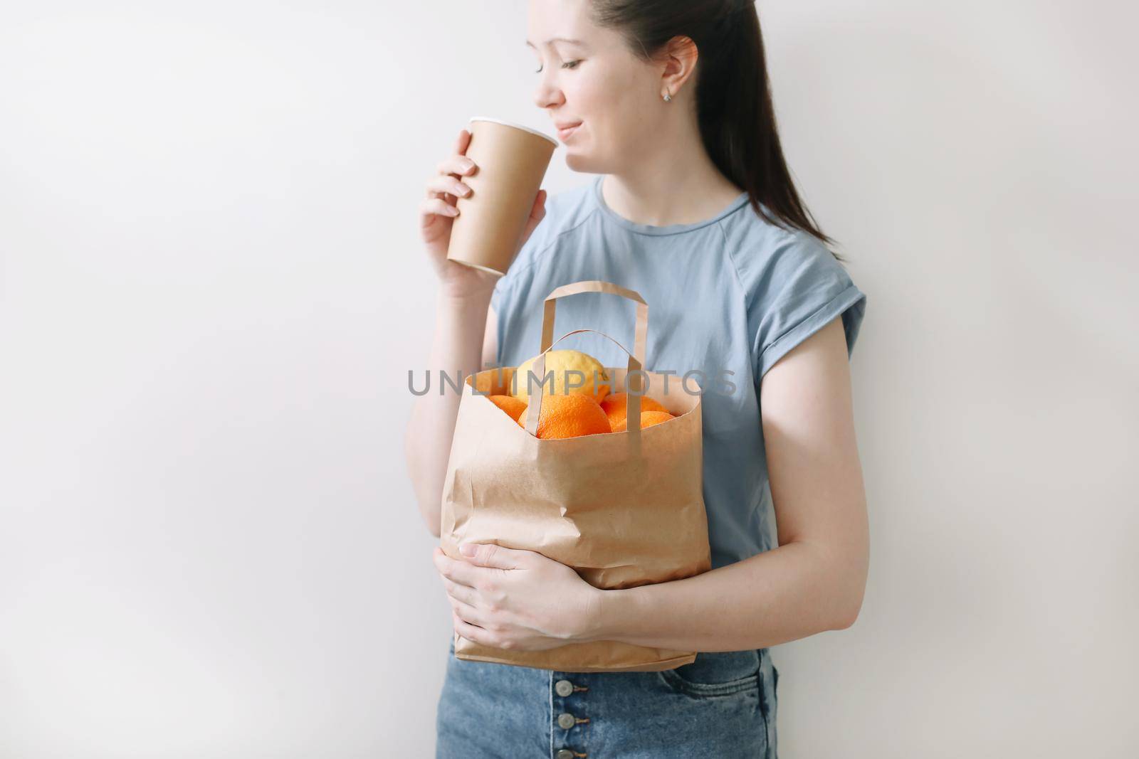 Delivery healthy food background. Vegan vegetarian food in paper bag vegetables and fruits on white, copy space, banner.Grocery shopping food supermarket and clean vegan eating concept.