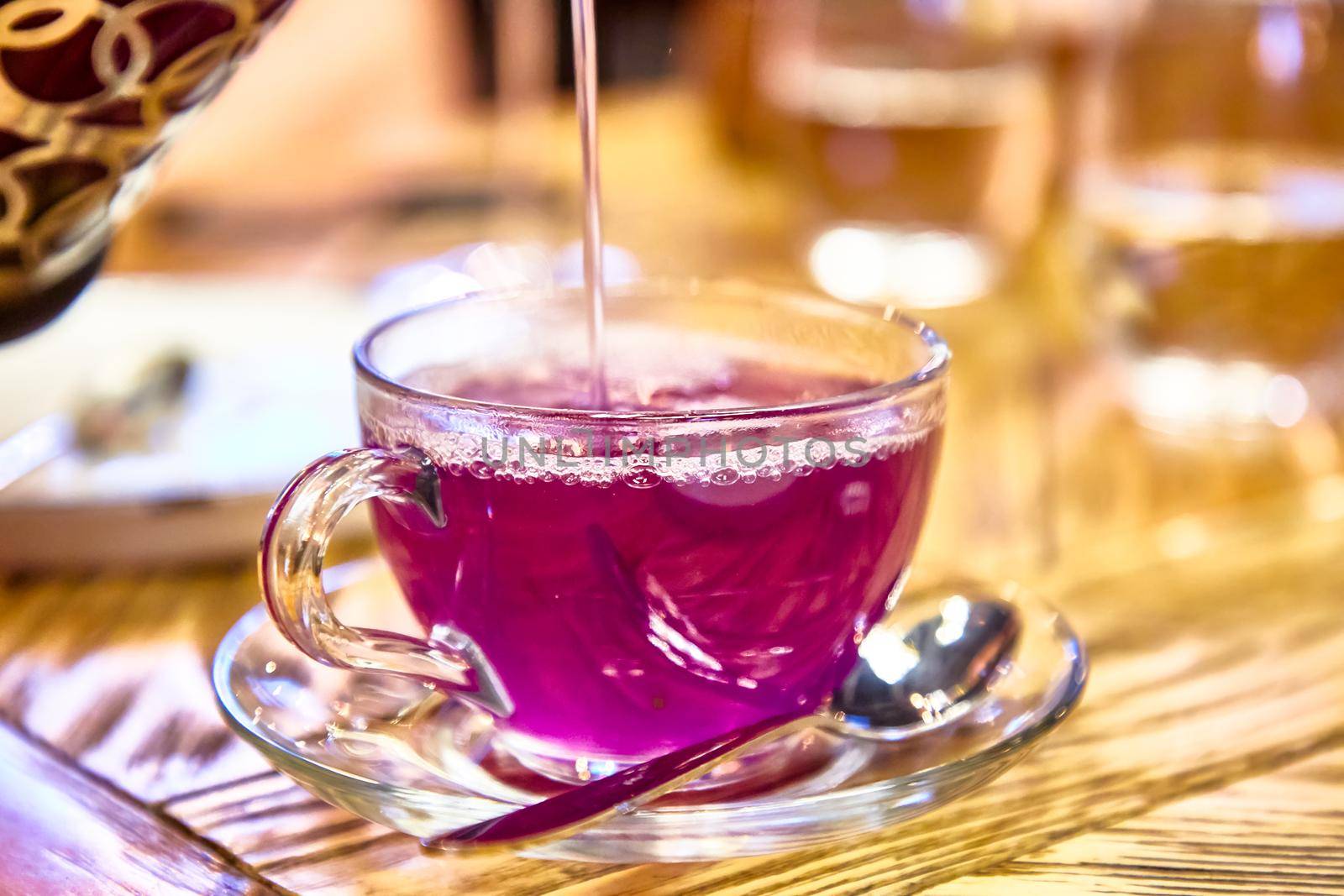 Fruit lilac tea with lavender in a glass Cup. by Milanchikov