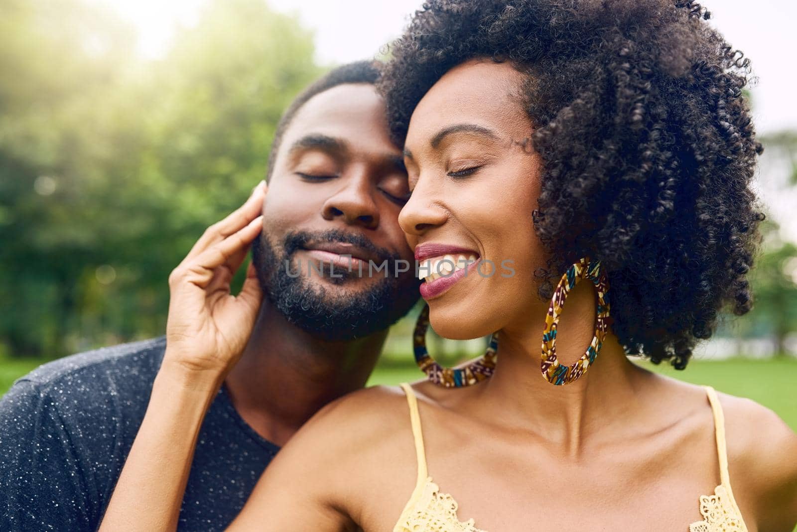 Cropped shot of an affectionate young couple spending some time together in the park.