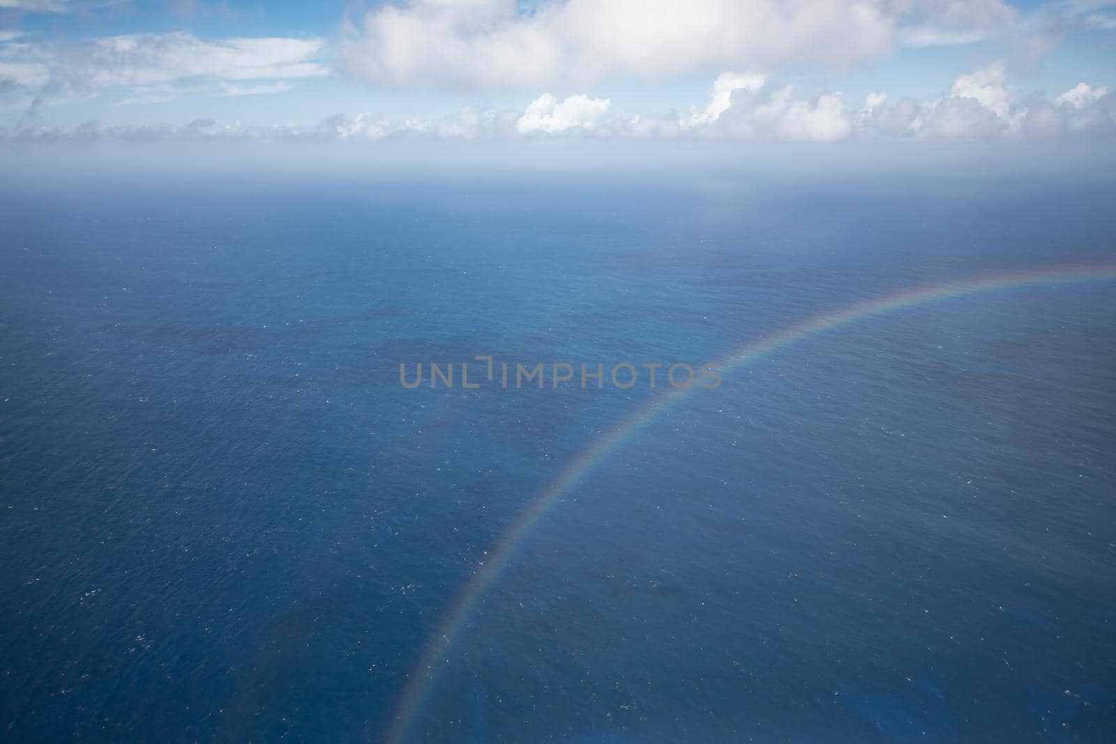 Rainbow crossing a dreamy seascape in Kauai