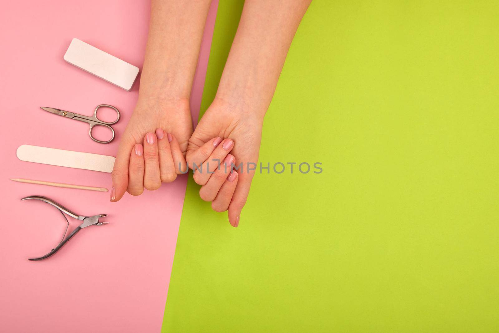 Female hands with beautiful manicure on color background by Demkat