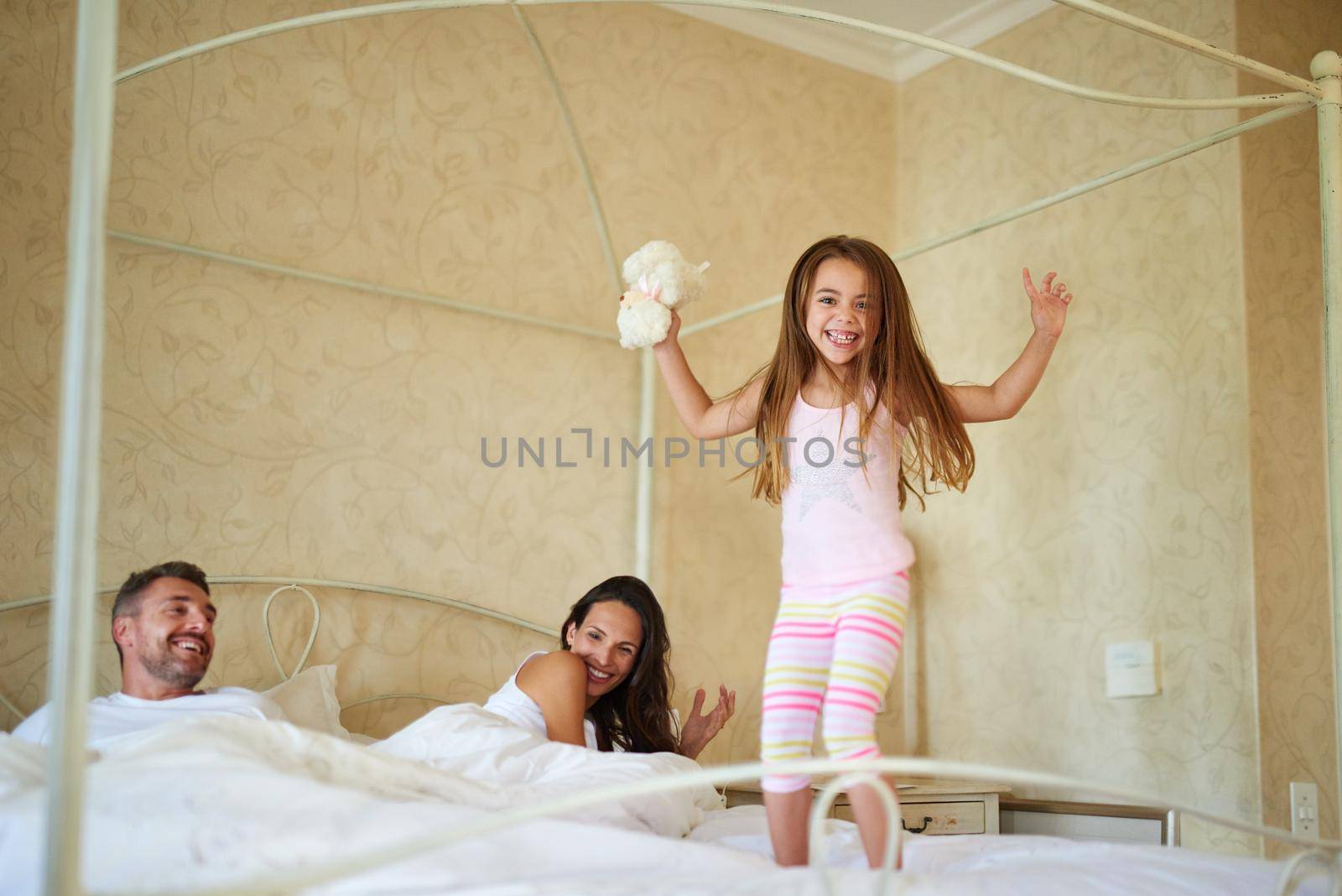 Shot of a family in the bedroom at home.