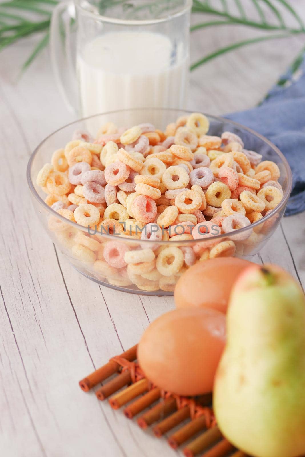 close up of colorful cereal corn flakes in a bowl .