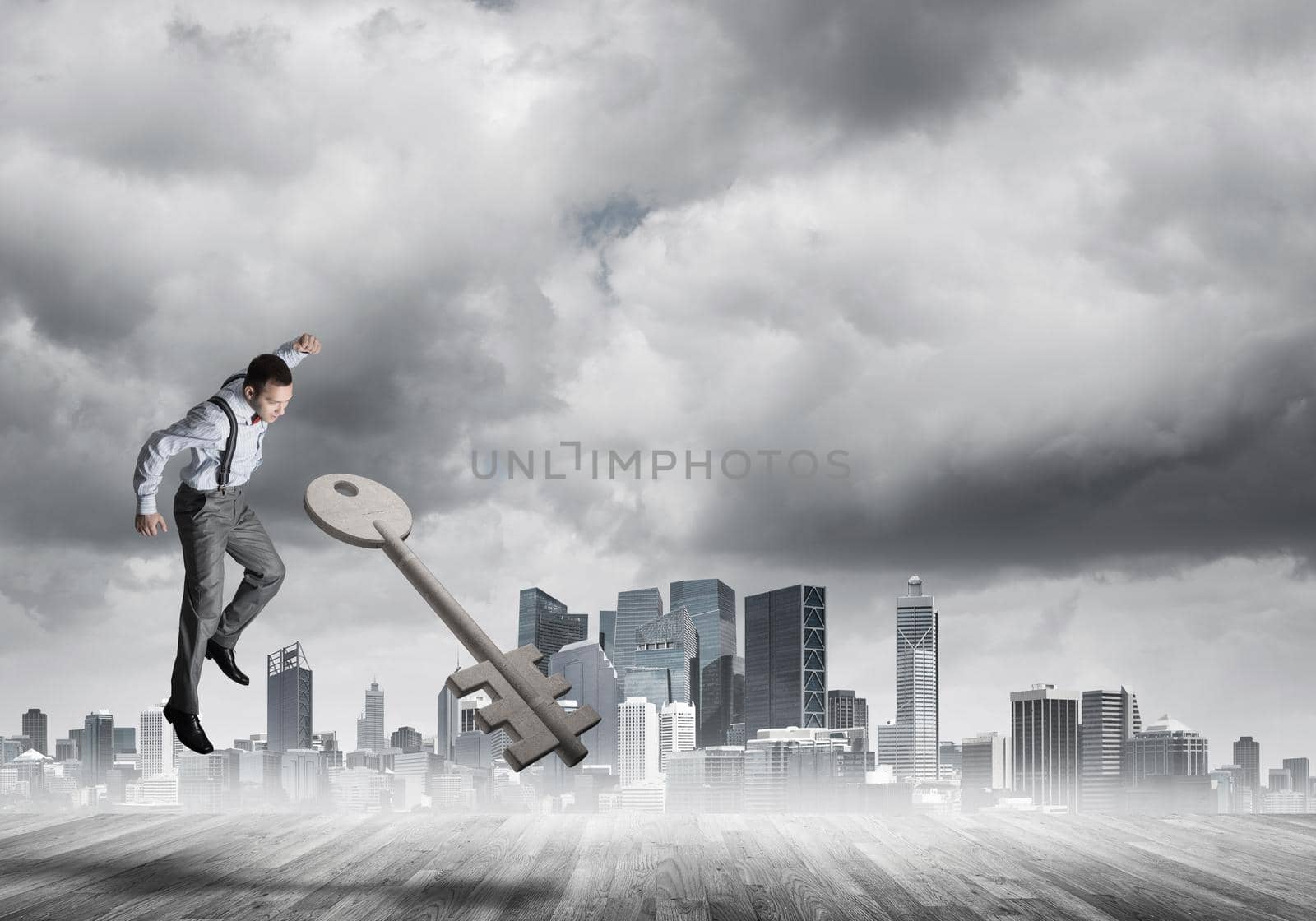 Determined businessman against modern cityscape breaking with fist stone key figure