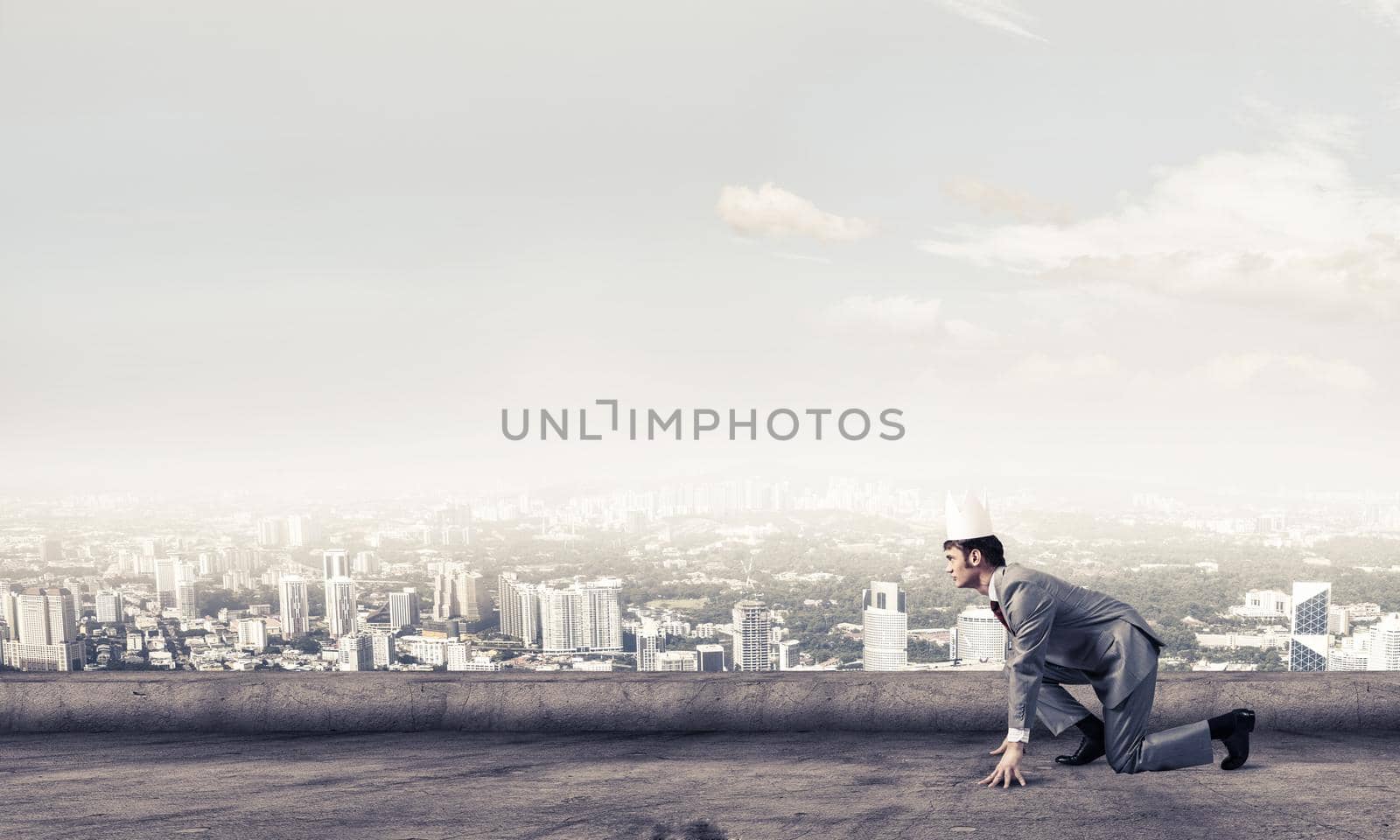 King businessman in elegant suit running on building roof and business center at background by adam121