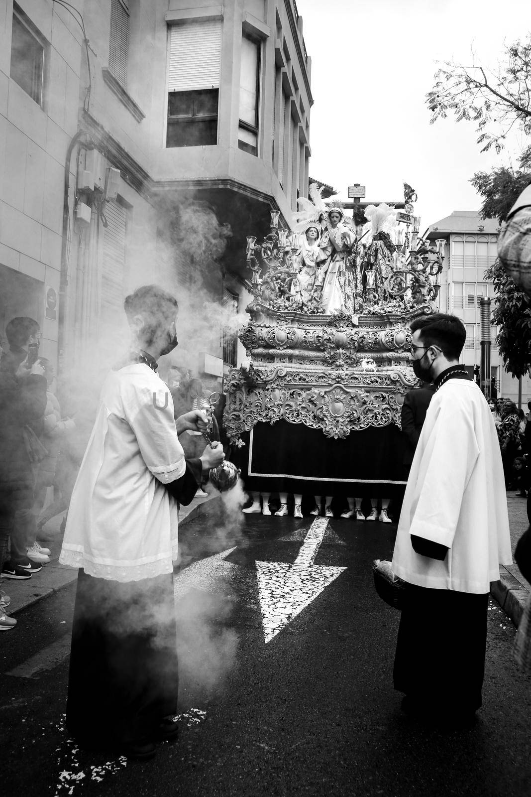 Elche, Spain- April 13, 2022: Easter Parade with altar boys and penitents through the streets of Elche city in the Holy Week