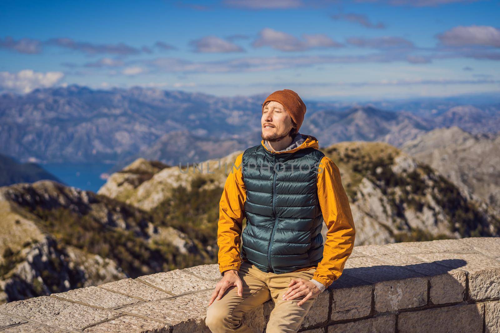 Man traveller in mountain landscape at national park Lovcen, Montenegro. Travel to Montenegro concept.