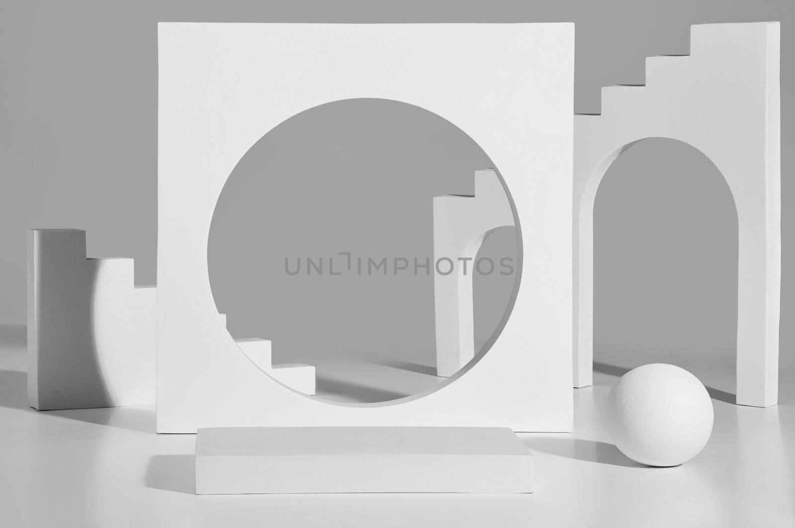 Empty square platform and geometric elements with steps, arched and round openings on gray background. Abstract showcase mockup for product presentation