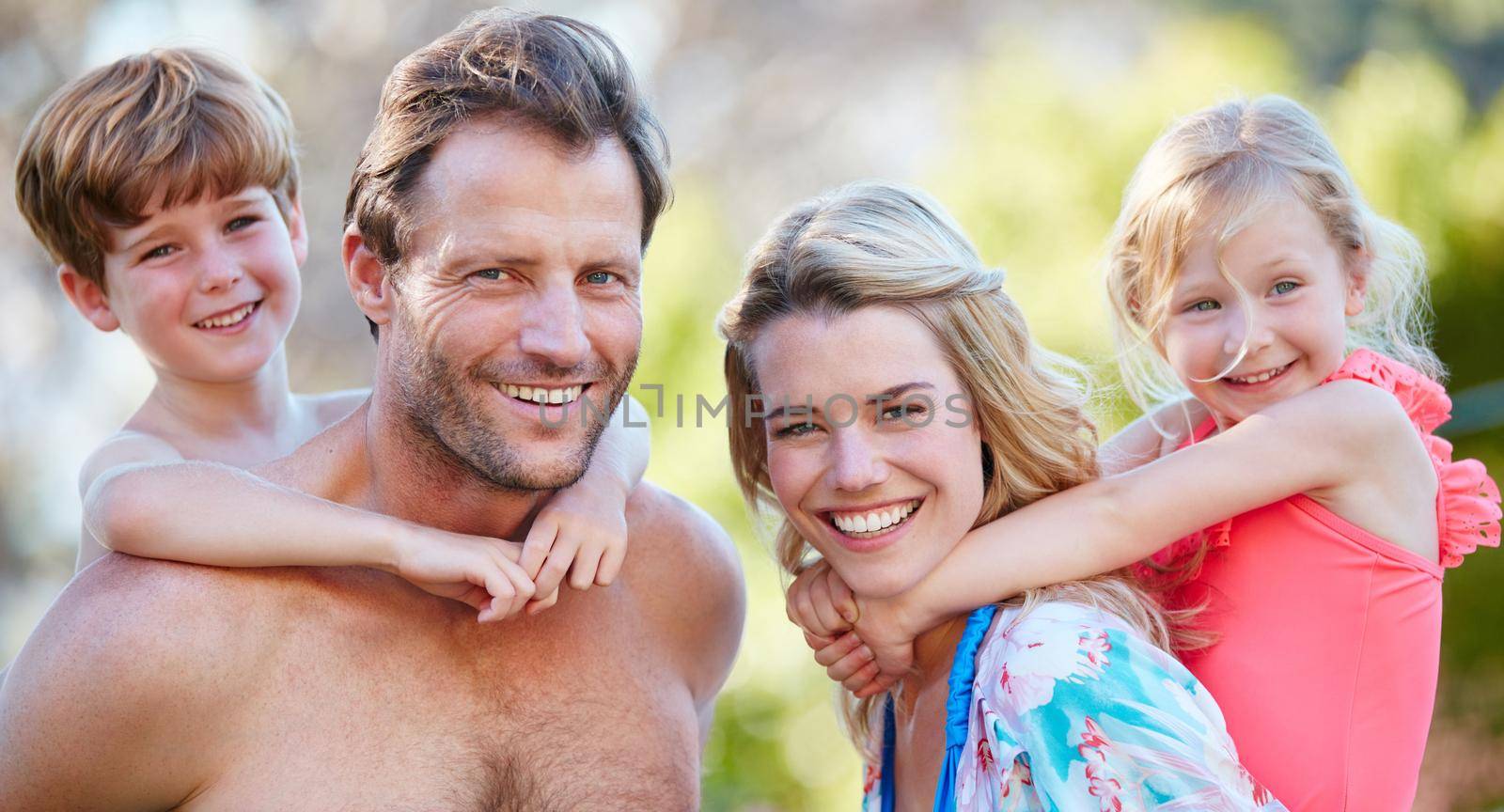 Portrait of a happy family enjoying a day outdoors together.