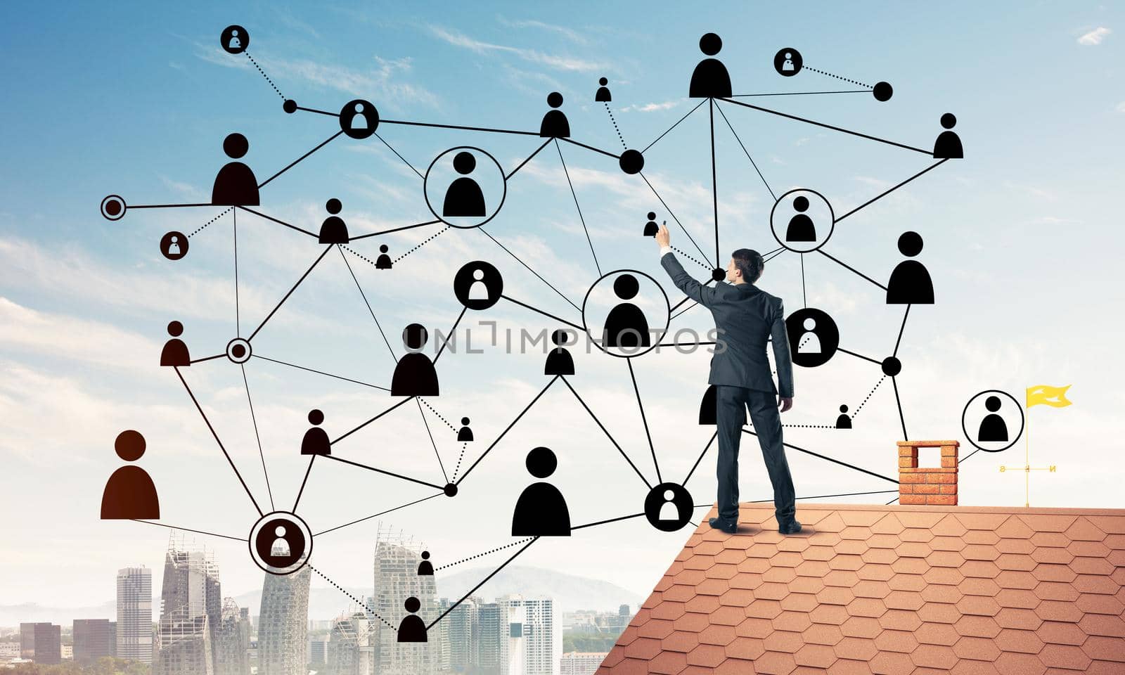 Businessman on house roof presenting networking and connection c by adam121