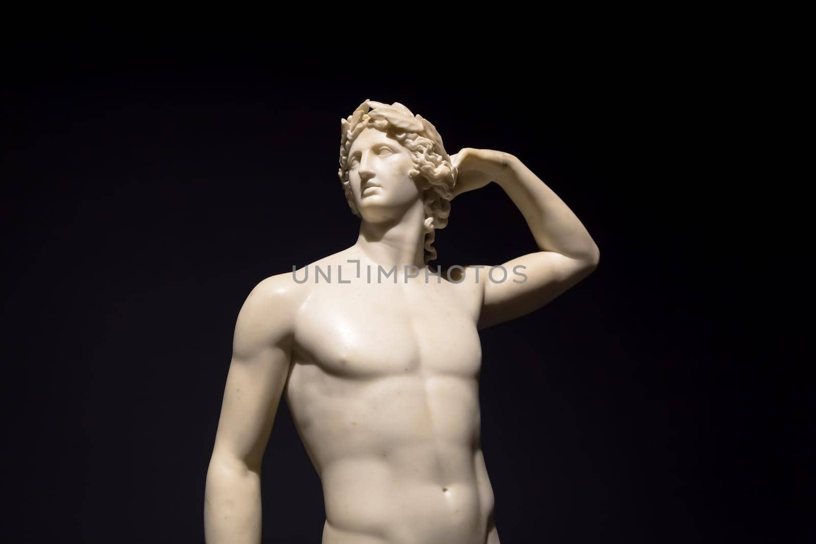 MILAN, ITALY - June 2020:  the ancient sculpture Apollo Crowning Himself - 1782 - Antonio Canova's masterpiece. Intesa Italian Museum.