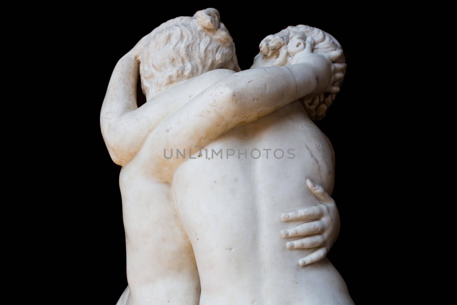 Togetherness emotion. Statue of two people embracing with passion by Perseomedusa