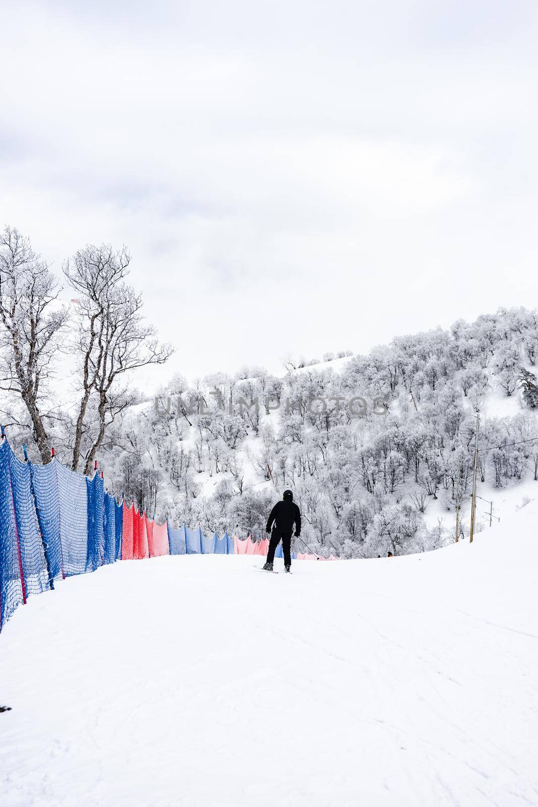 Blue safety web on ski road in Bakuriani skiing resort in Georgia