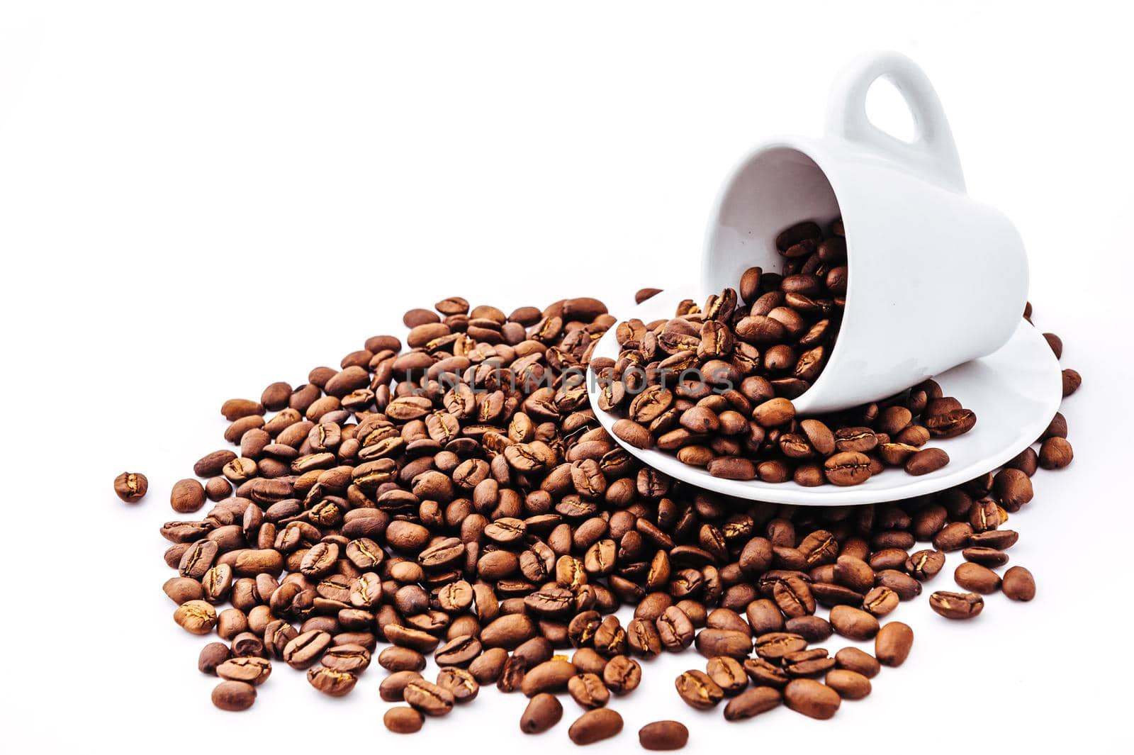 white cup with coffee beans isolated