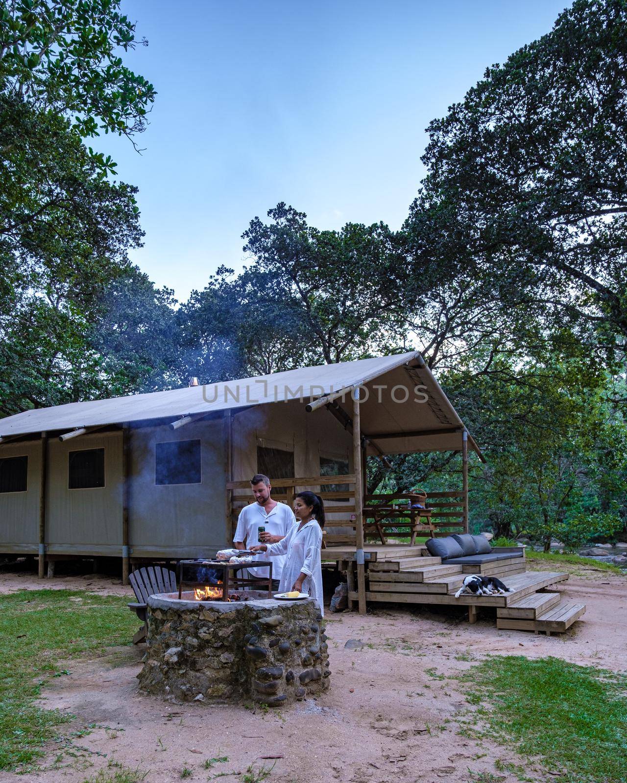 Budget Safari tent in South Africa for family vacations in the nature , couple man and woman camping safari tent