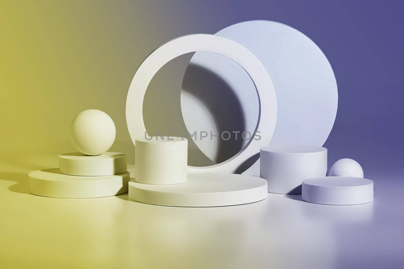 Abstract podium mockup for displaying product consisting of cylinders, rings and balls of different sizes, toned image