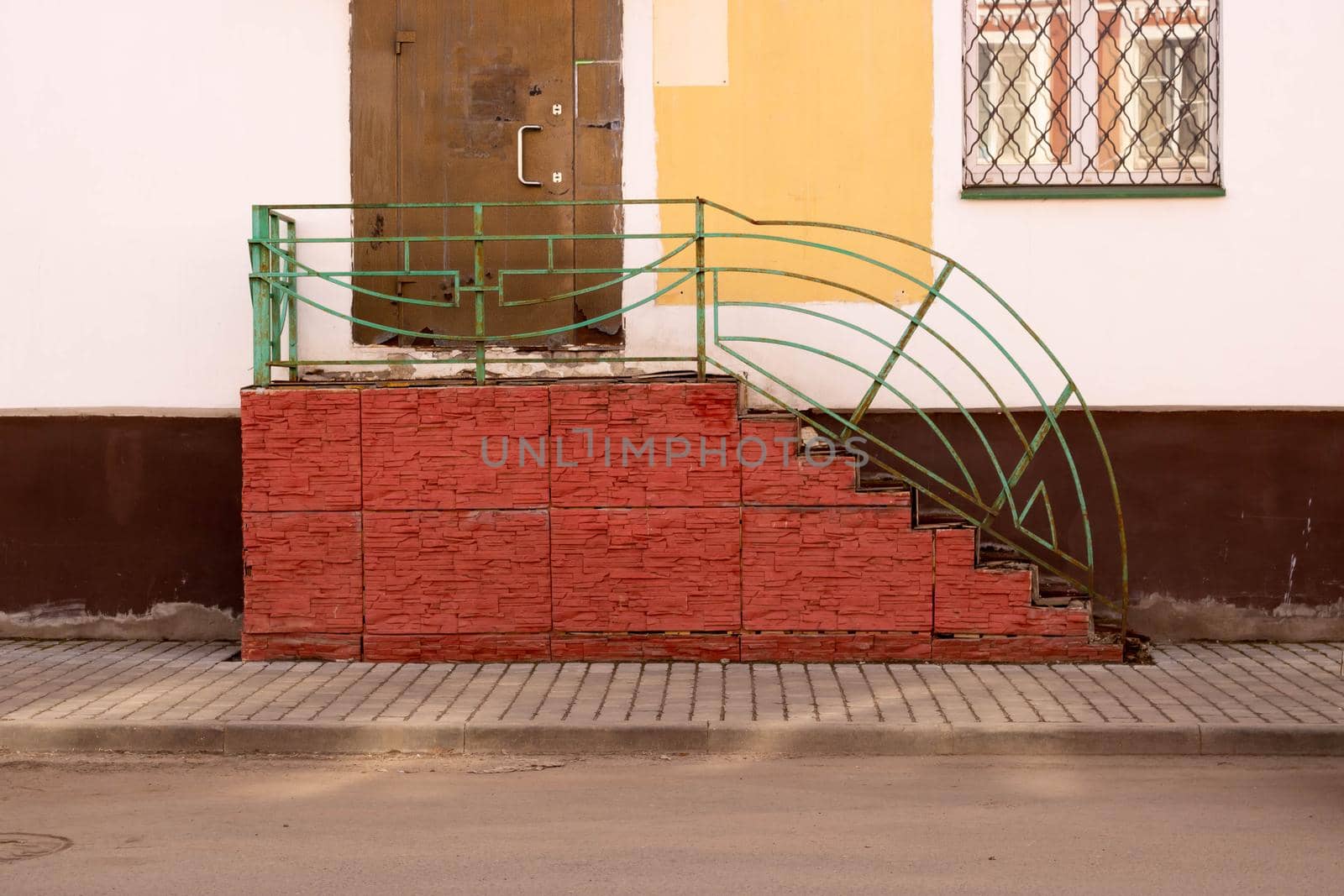An old red porch with rusty railings and doors by lapushka62