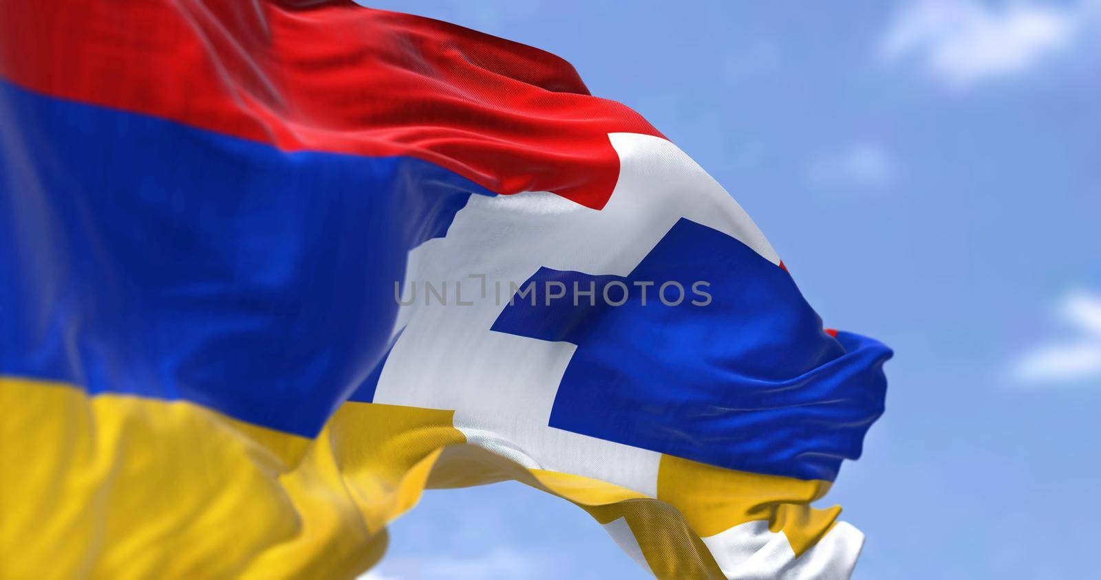 Close-up view of the flag of the breakaway Republic of Artsakh waving in the wind. In the background a clear sky. Artsakh, aka Nagorno-Karabakh Republicis a state supported by Armenia. Selective focus