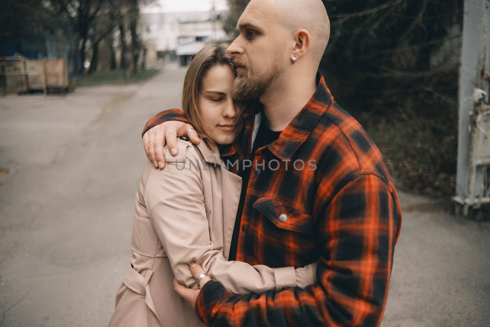 couple of lovers embracing closeup outdoors