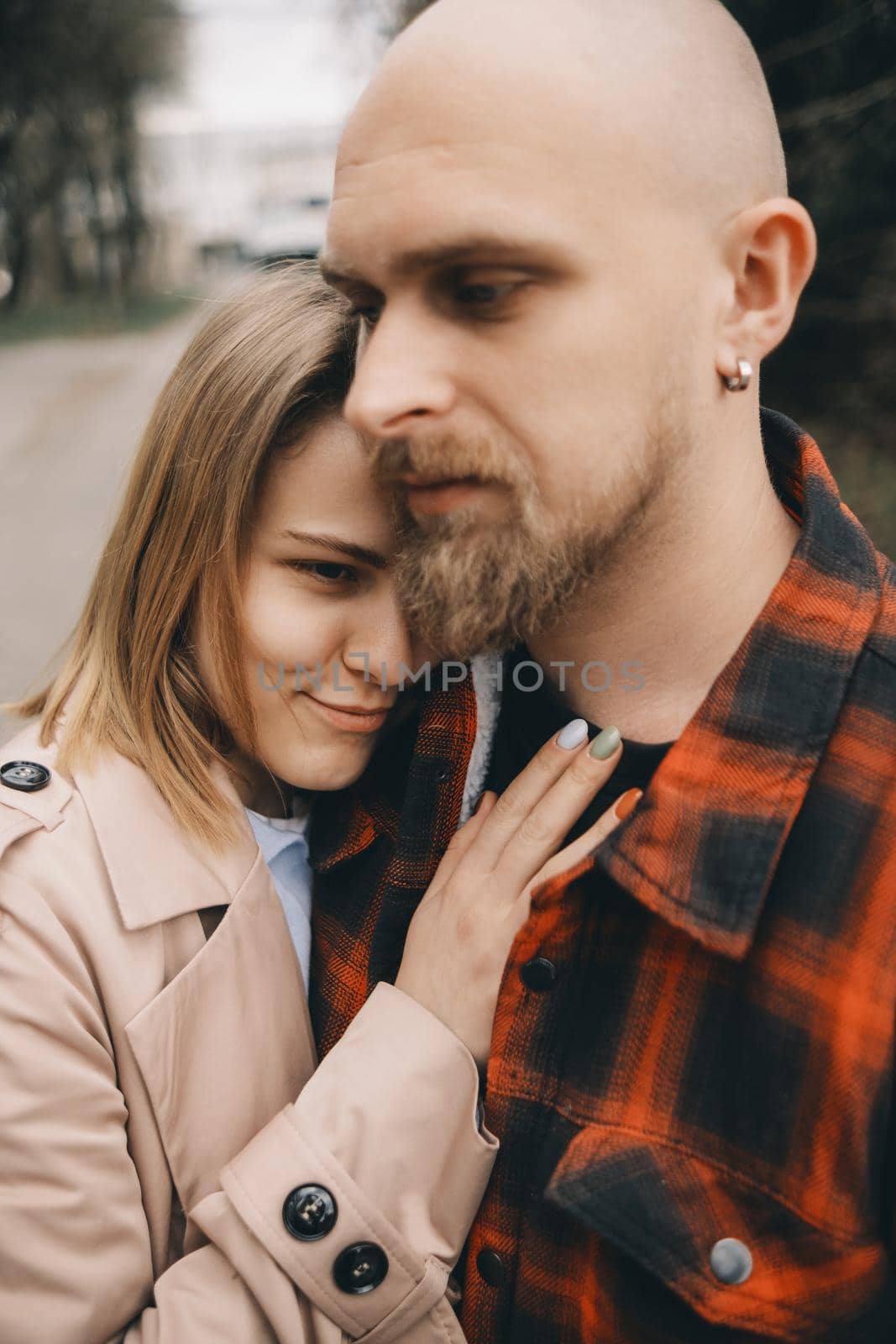 couple of lovers embracing closeup outdoors