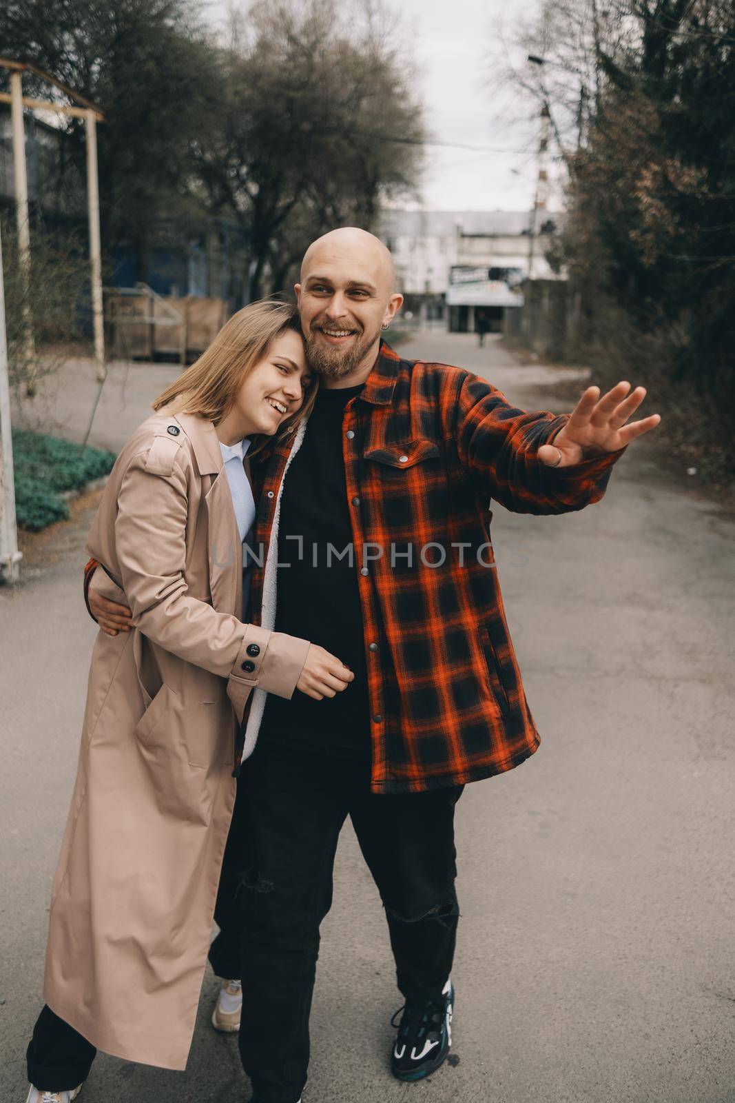 Loving caucasian blond couple walking at street