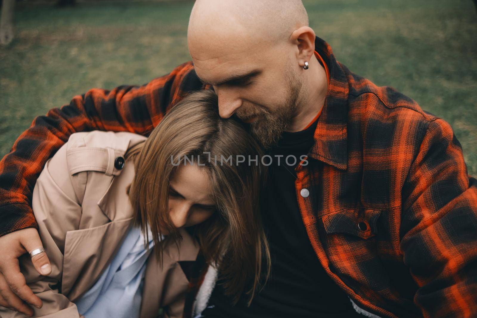 young couple laying on grass. summer love outdoors