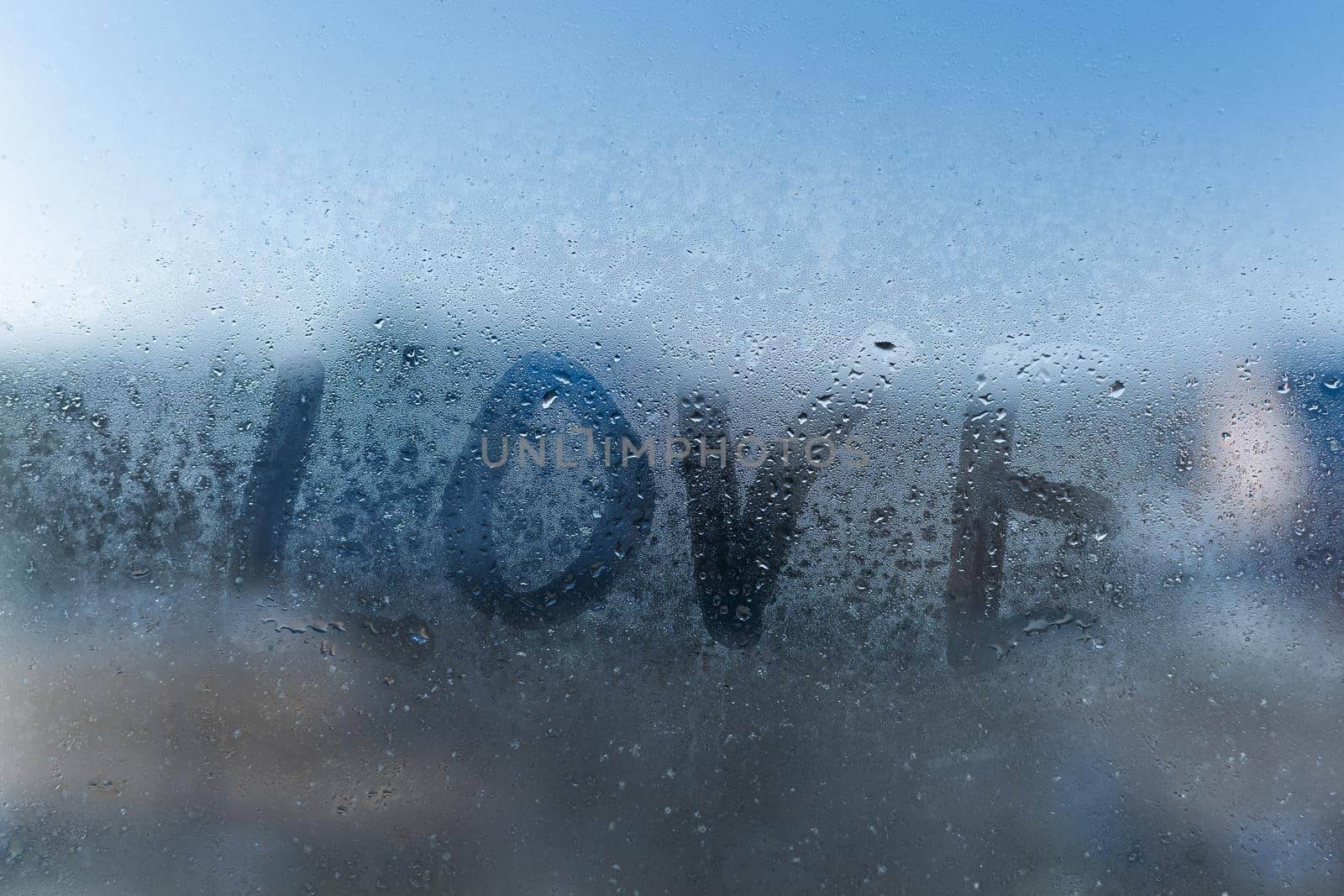 word love on a foggy window.