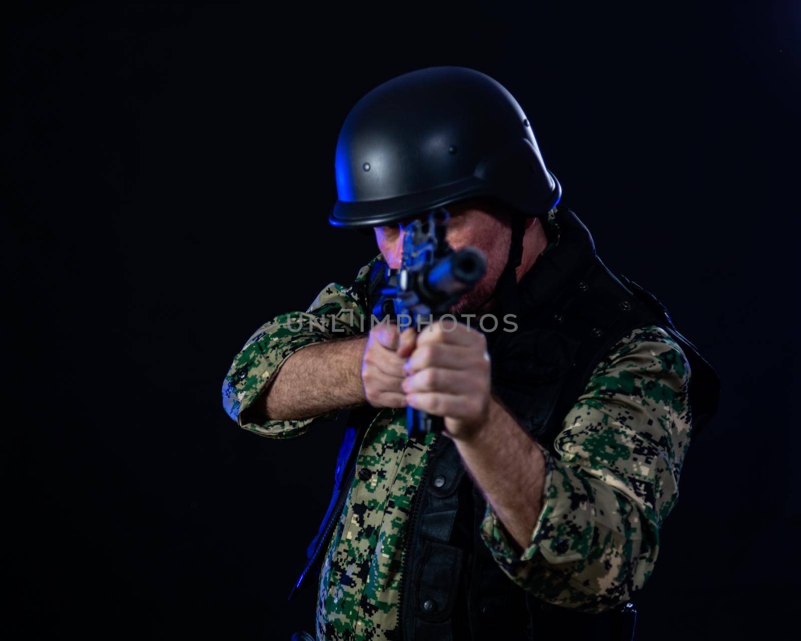 Soldier holding assault rifle by imagesbykenny