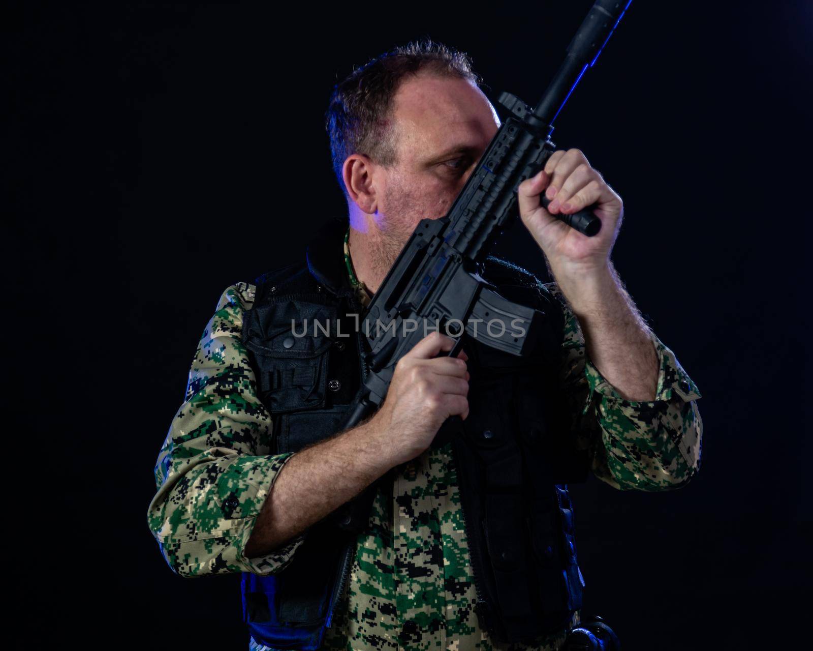 Soldier holding assault rifle by imagesbykenny
