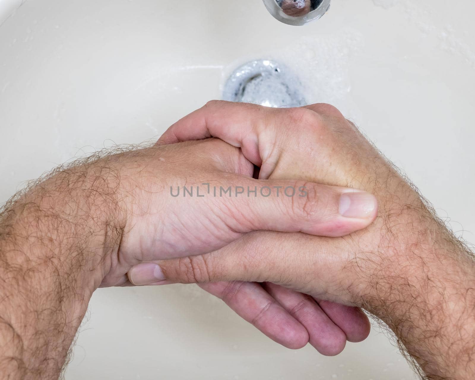 Man washing hands close-up from above by imagesbykenny