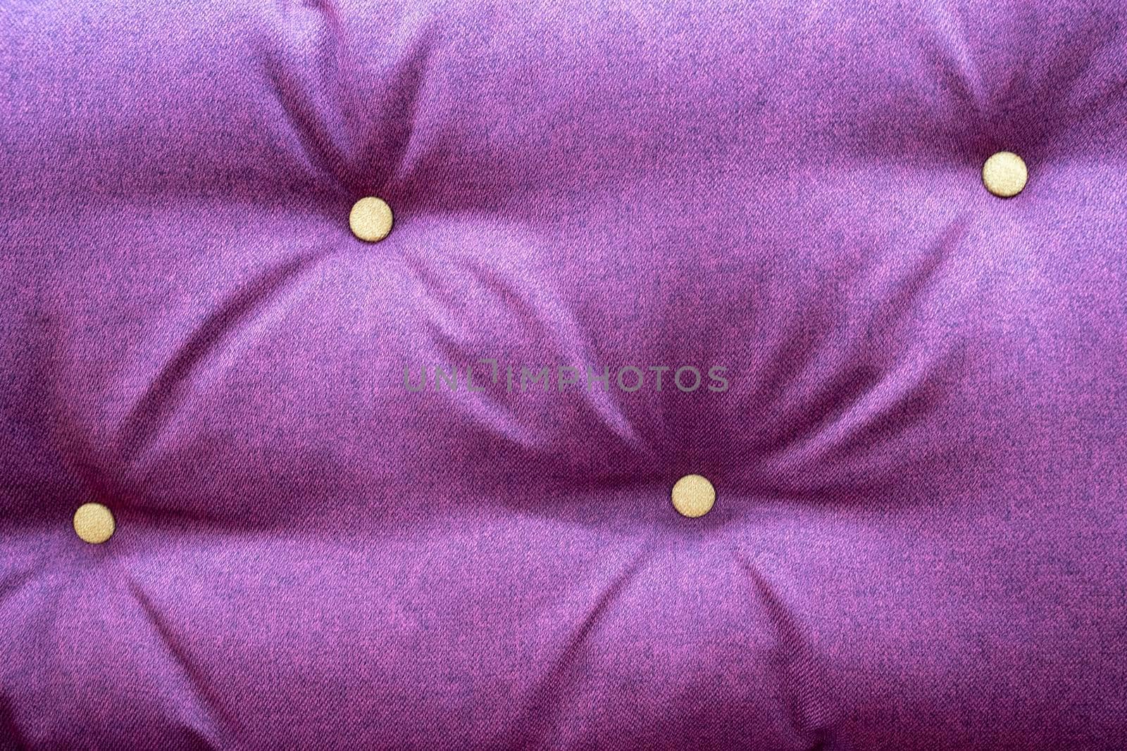 background of burgundy furniture fabric with decorative buttons. sofa upholstery, furniture