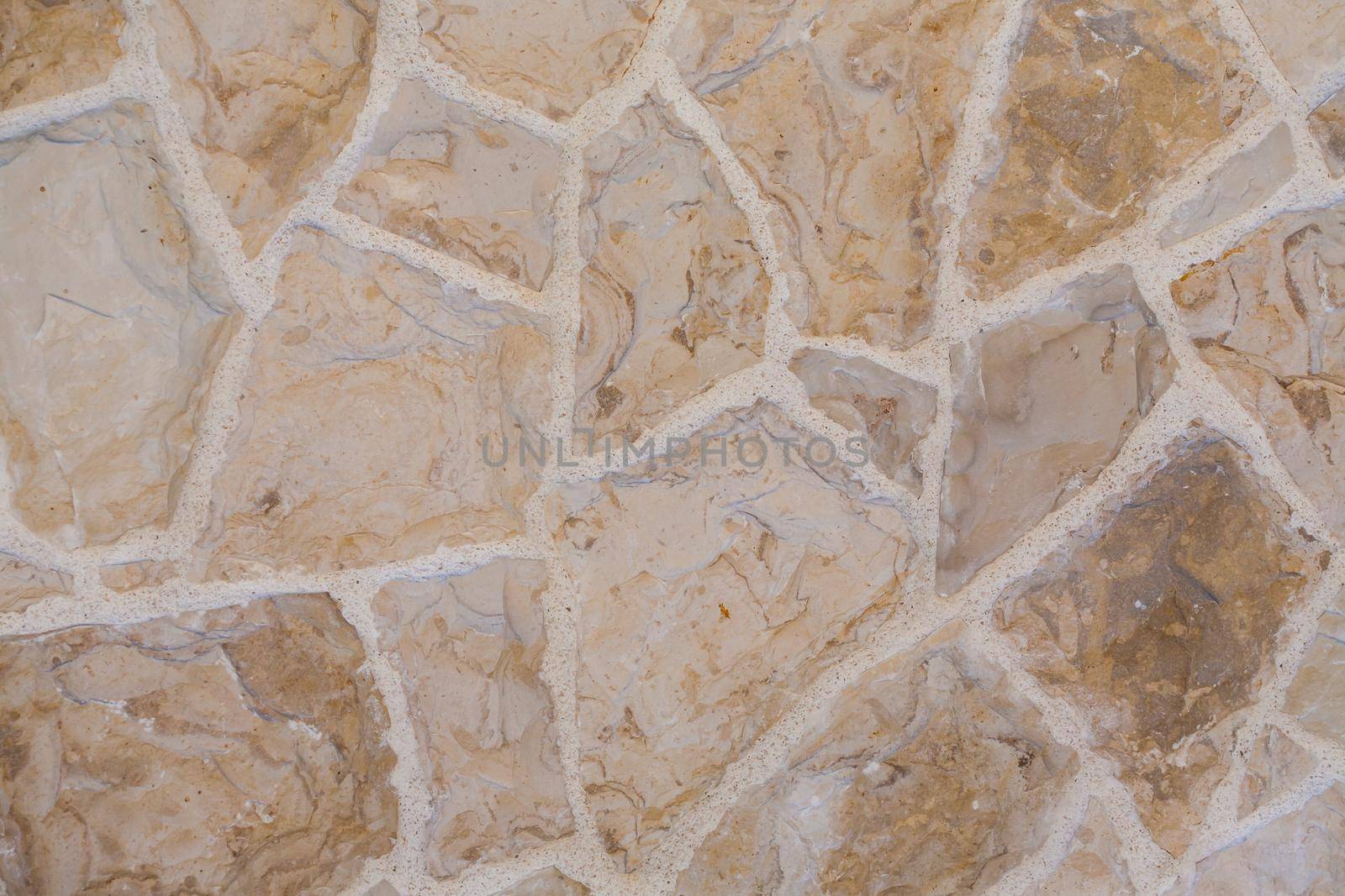 Stone slabs laid on the floor. Shades of brown in full frame.