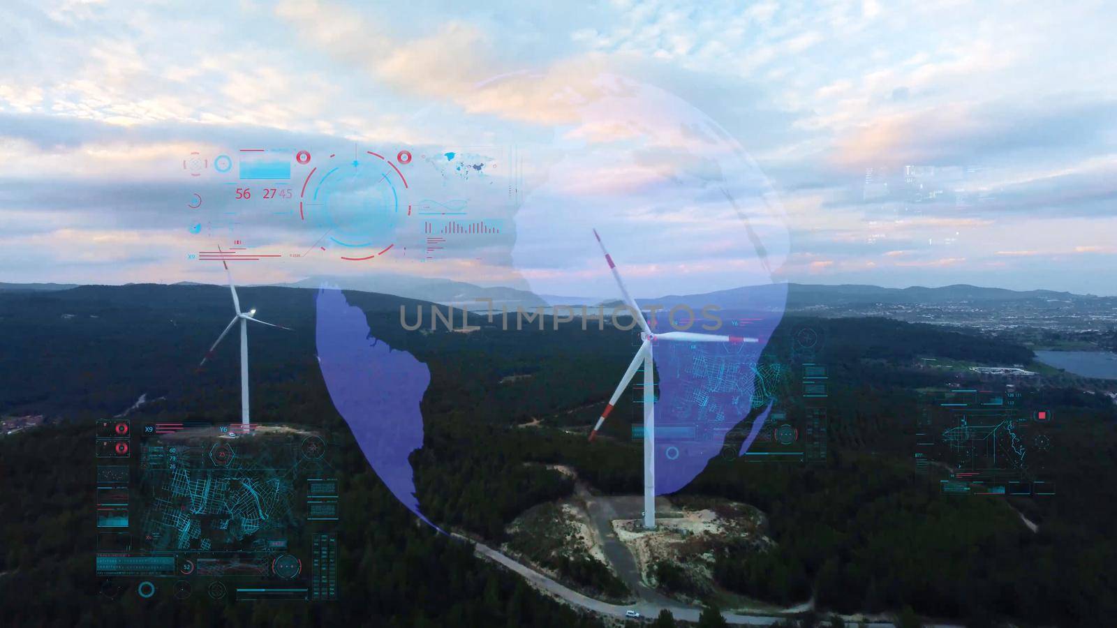 Aerial view over the farm landscape and wind turbines generating clean renewable energy. Renewable energy production for the green ecological world. High quality photo