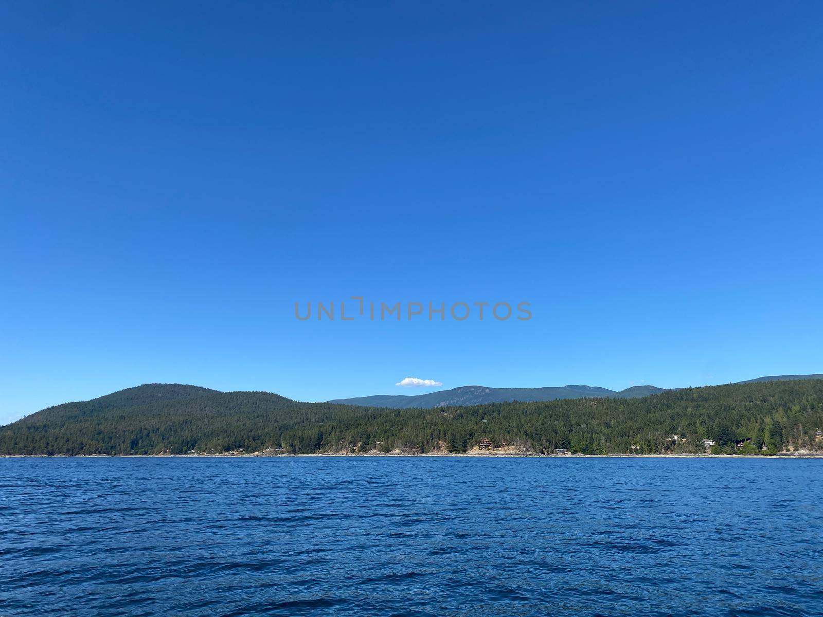 View of Sunshine Coast mountains from the water by Granchinho