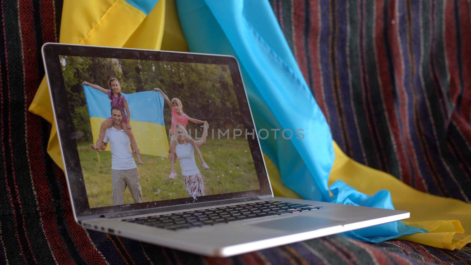 laptop near the ukraine flag. online conference.