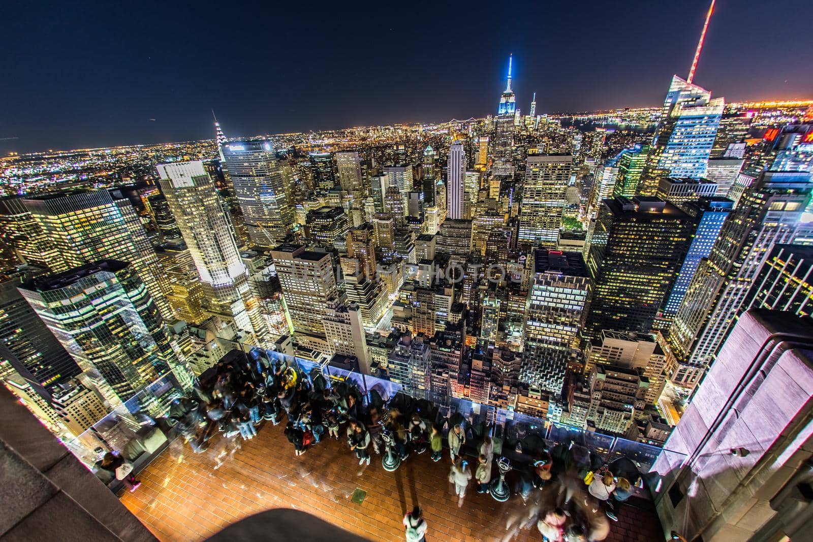People looking at night view from Rockefeller Center Observatory (Top of the Rock) 7. Shooting Location: New York, Manhattan