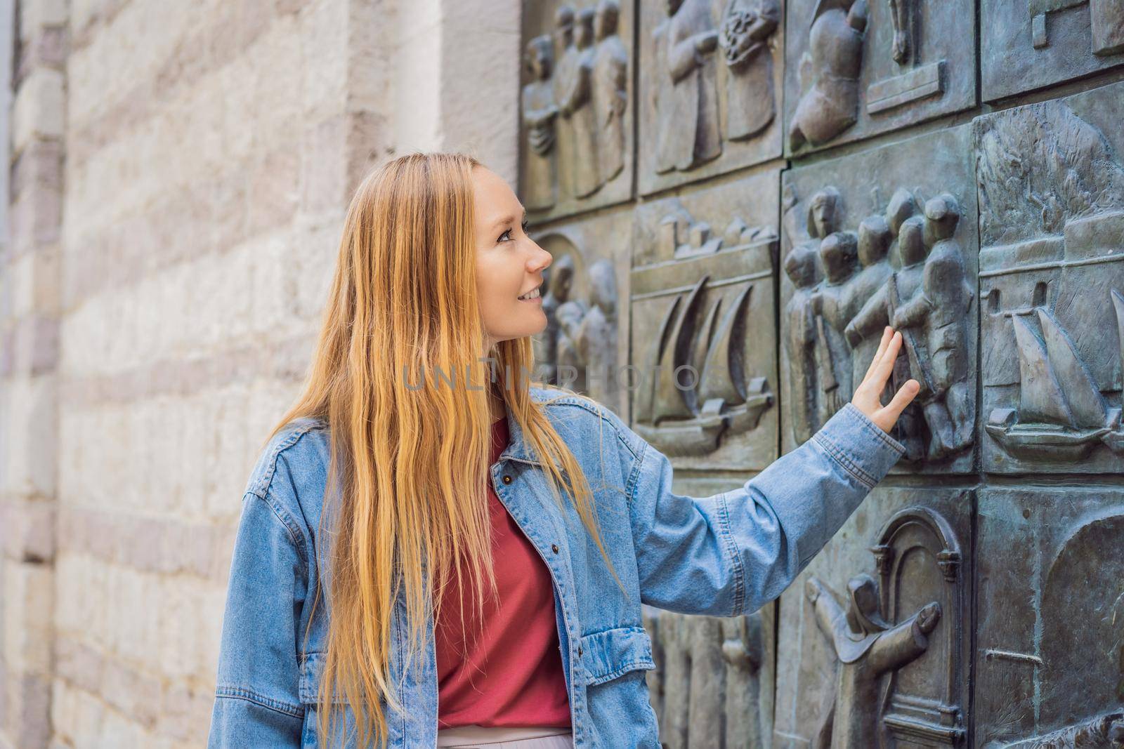 Woman tourist enjoying Colorful street in Old town of Kotor on a sunny day, Montenegro. Travel to Montenegro concept.